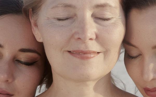 Three women enjoying each others vibrant skin
